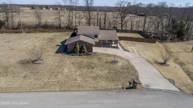 birds eye view of property featuring a rural view