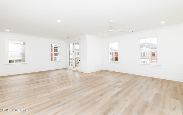 empty room with ornamental molding, recessed lighting, and light wood-style floors