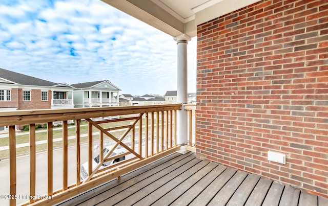 wooden terrace featuring a residential view