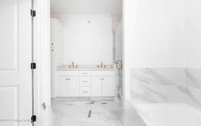 full bathroom with a garden tub, double vanity, a stall shower, and a sink