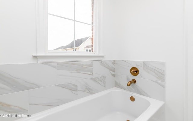 bathroom featuring a washtub