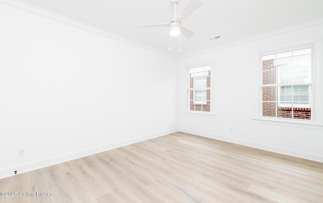 unfurnished room with baseboards, ceiling fan, light wood-style flooring, and crown molding