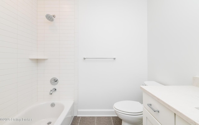 bathroom featuring toilet, vanity, baseboards, and shower / bathing tub combination