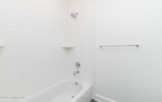 full bath featuring bathing tub / shower combination and baseboards