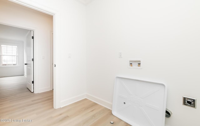 laundry room featuring hookup for an electric dryer, laundry area, washer hookup, baseboards, and light wood-type flooring