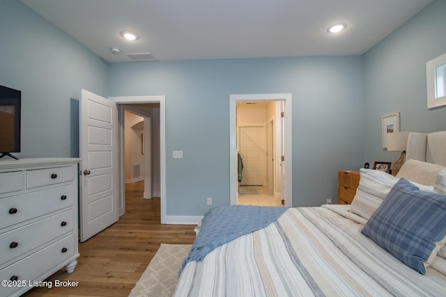 bedroom with recessed lighting, visible vents, baseboards, and light wood-style flooring