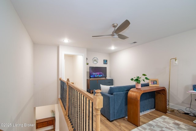 office featuring recessed lighting, visible vents, light wood-style flooring, and a ceiling fan