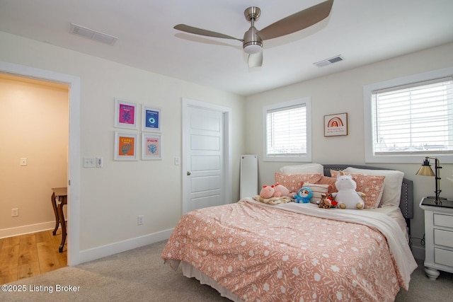 bedroom with visible vents, a ceiling fan, baseboards, and carpet floors