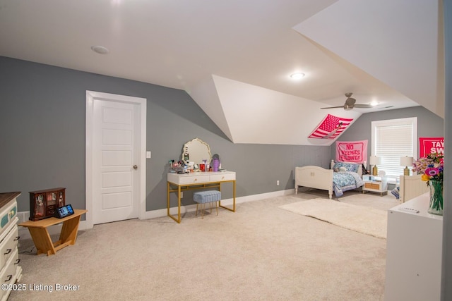 carpeted bedroom featuring ceiling fan, baseboards, and lofted ceiling