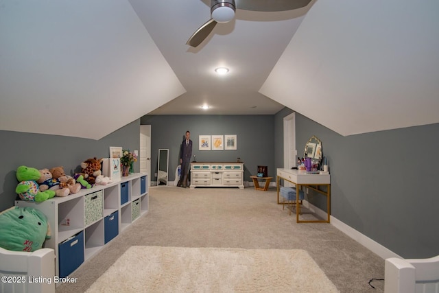 playroom with baseboards, lofted ceiling, light colored carpet, and ceiling fan