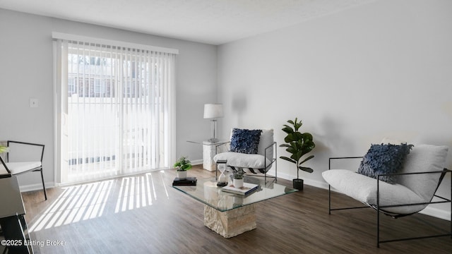 sitting room featuring wood finished floors and baseboards