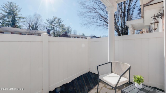 view of patio featuring fence