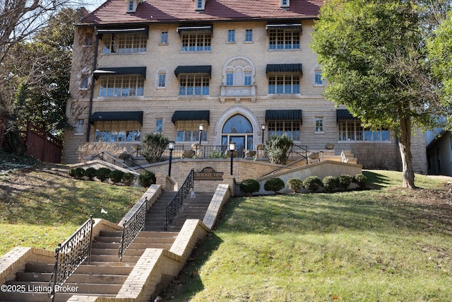 view of property featuring stairway