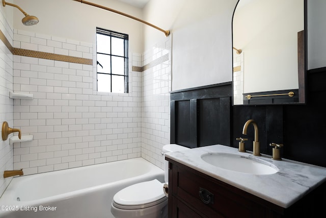 bathroom with  shower combination, vanity, and toilet