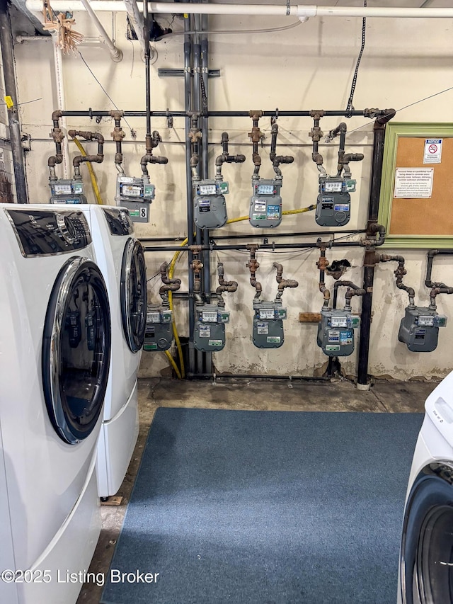 washroom with laundry area and washer and dryer