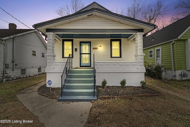 view of front of property featuring covered porch