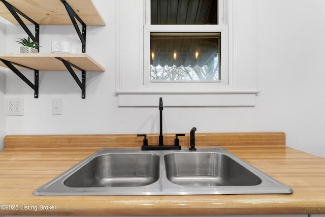 details featuring light countertops and a sink