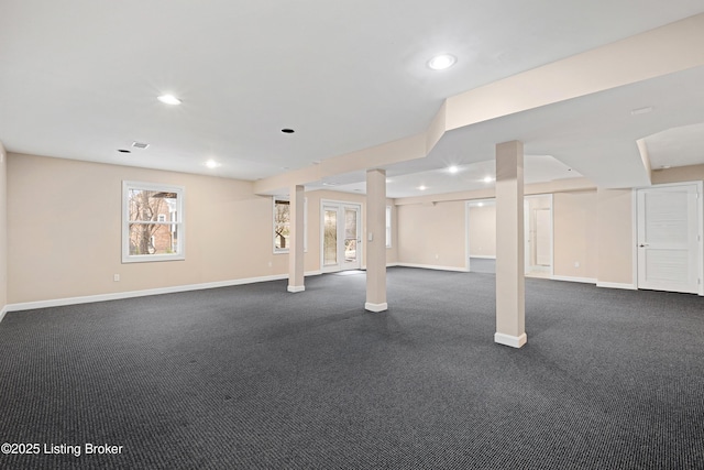 below grade area featuring visible vents, baseboards, and recessed lighting