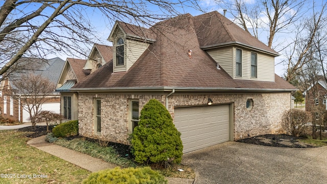 view of home's exterior with a garage, roof with shingles, driveway, and brick siding