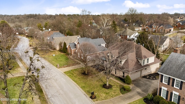 birds eye view of property with a residential view