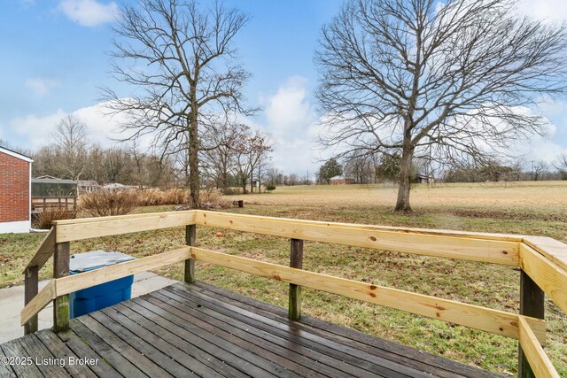 wooden deck with a lawn