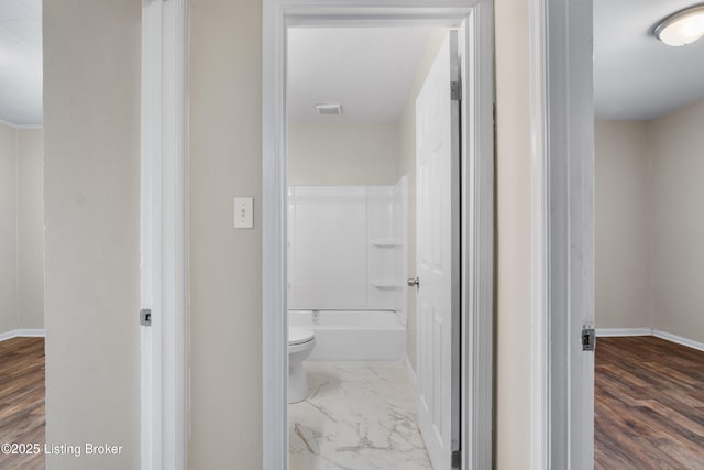 bathroom featuring visible vents, marble finish floor, toilet, and baseboards