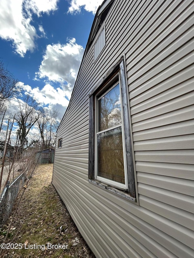 view of property exterior featuring fence