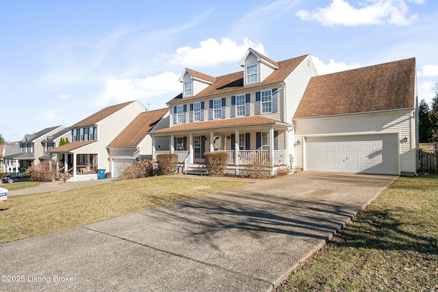 view of front of house with roof with shingles, a porch, an attached garage, a front yard, and driveway