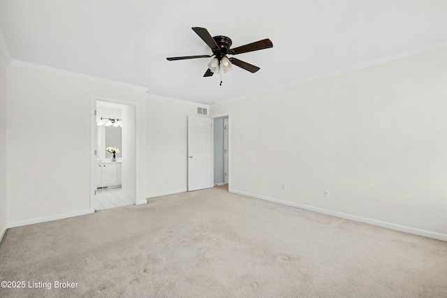 unfurnished bedroom with ornamental molding, carpet, visible vents, and baseboards