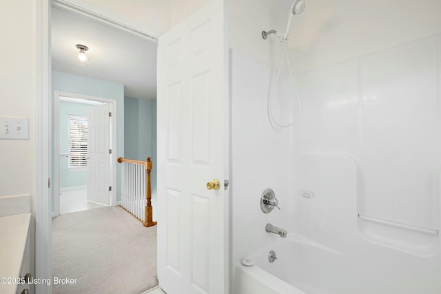 full bath featuring vanity and bathing tub / shower combination