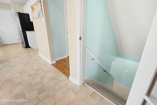 interior space featuring tile patterned floors and baseboards