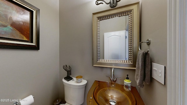 half bath with toilet and vanity