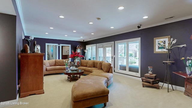 carpeted living area featuring recessed lighting, visible vents, baseboards, and crown molding