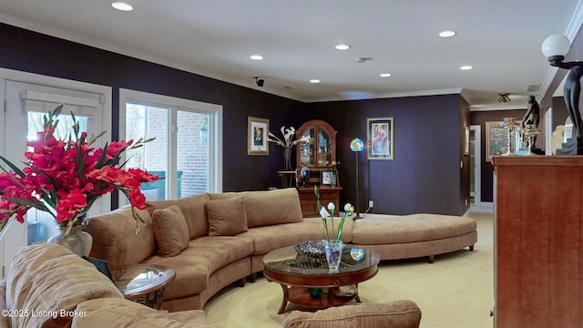 living area featuring carpet flooring, recessed lighting, and crown molding