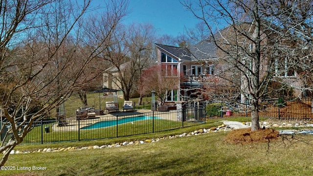 exterior space featuring a yard and fence