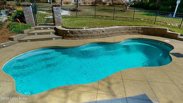 view of pool featuring a patio area and fence