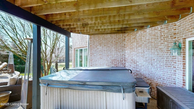 view of patio with a hot tub