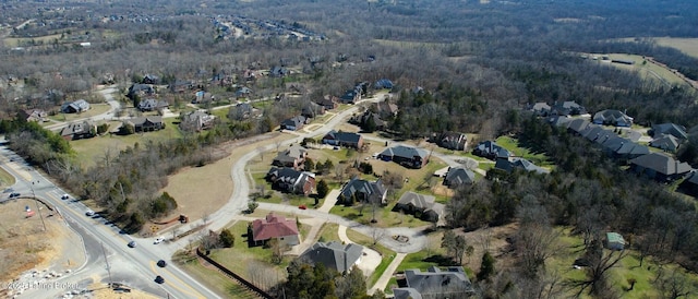 drone / aerial view with a view of trees and a residential view