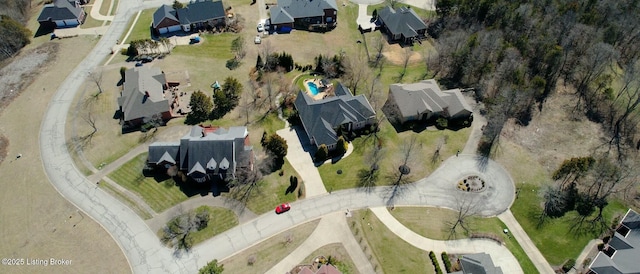 birds eye view of property with a residential view