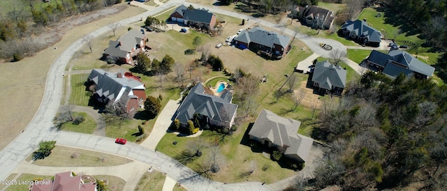 birds eye view of property with a residential view