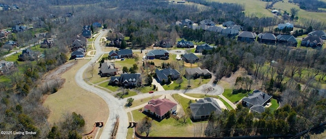 bird's eye view with a residential view and a view of trees