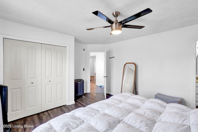 bedroom featuring a closet, ceiling fan, and dark wood-style flooring