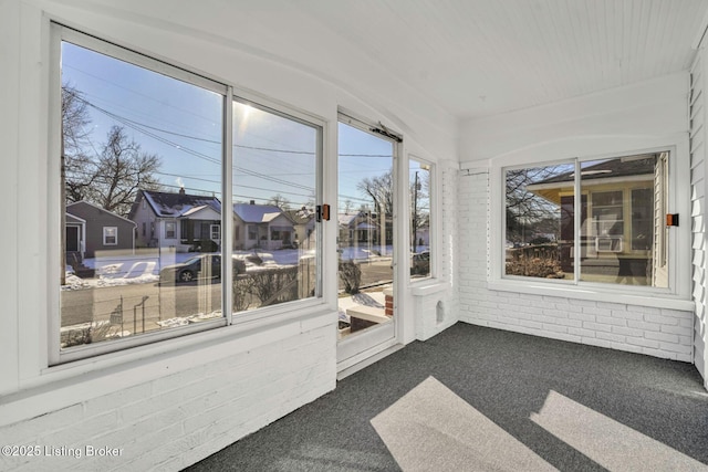 unfurnished sunroom with a residential view