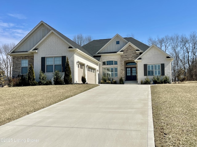 craftsman inspired home featuring brick siding, board and batten siding, concrete driveway, and an attached garage