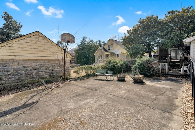 view of patio featuring fence