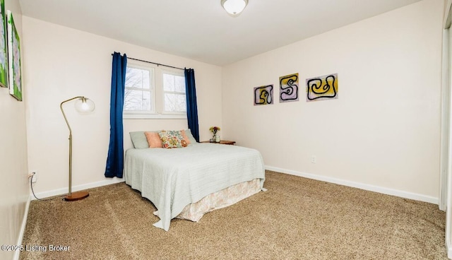 bedroom with carpet flooring and baseboards