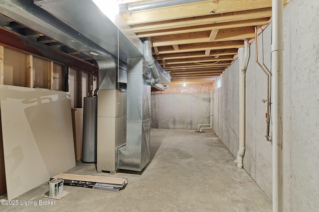 unfinished below grade area featuring heating unit and gas water heater