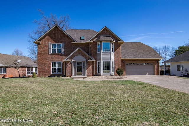 view of front of home featuring an attached garage, driveway, a front yard, and brick siding