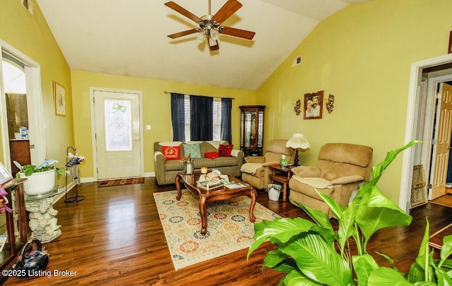 living room featuring lofted ceiling, ceiling fan, wood finished floors, visible vents, and baseboards