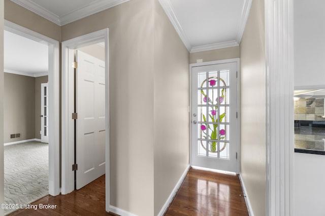 entrance foyer with crown molding, visible vents, dark wood-style flooring, and a wealth of natural light